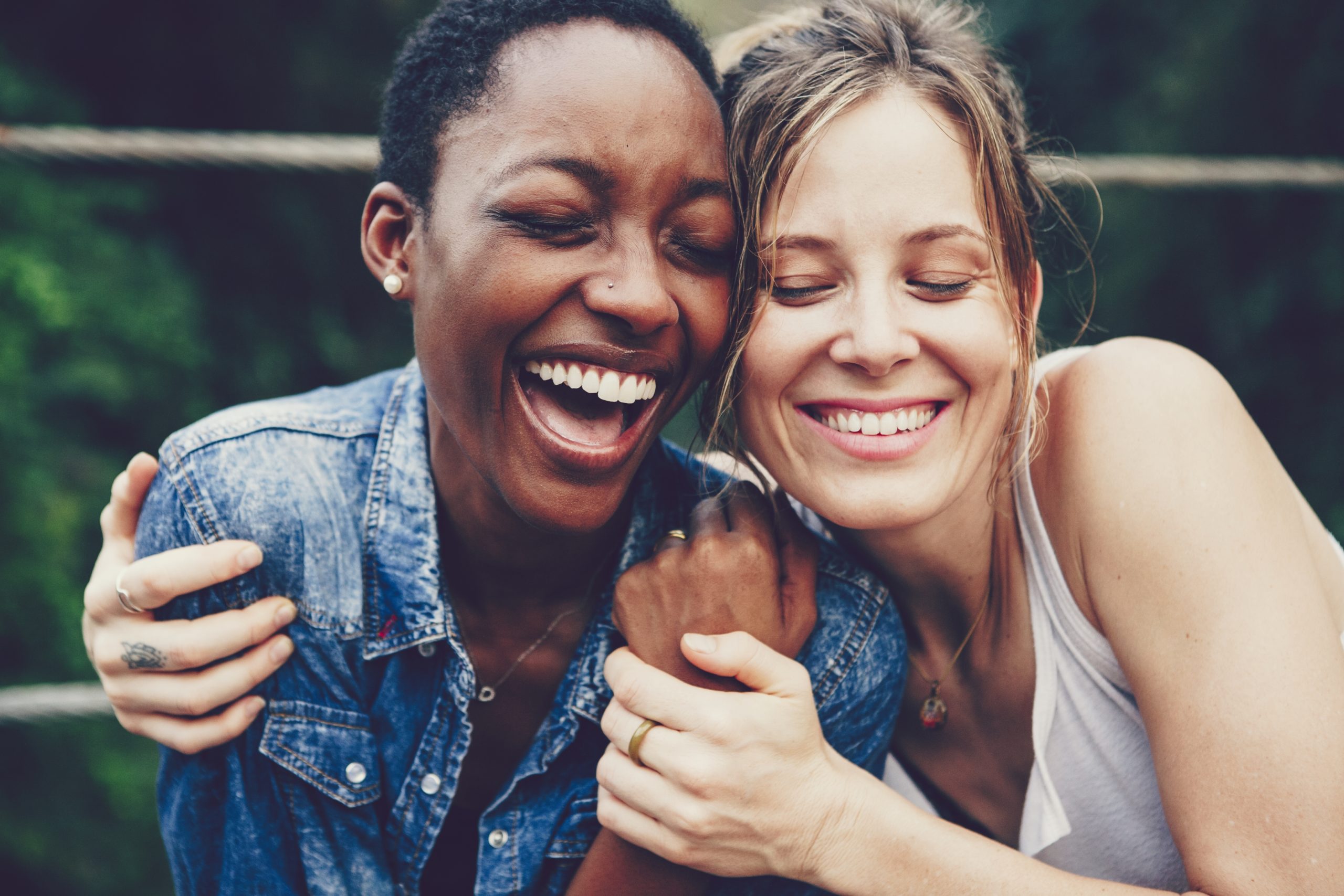 Happy friends holding each other